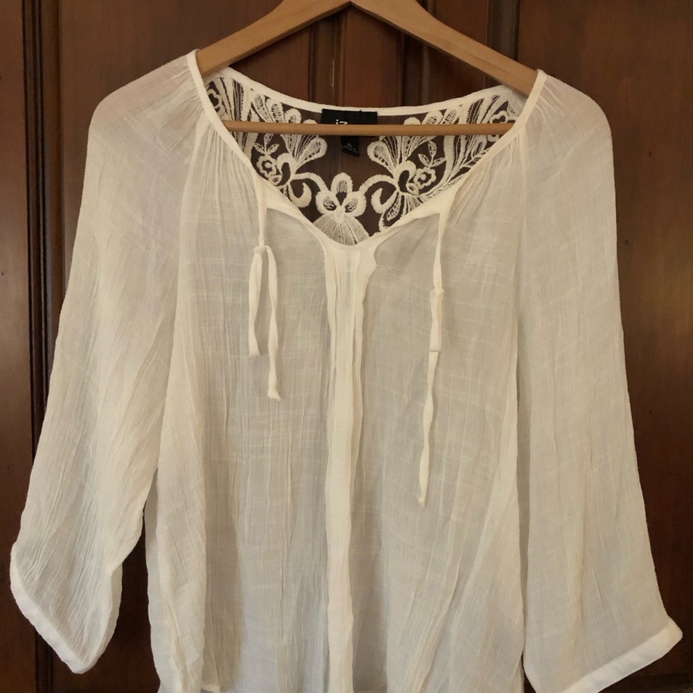 White top with back lace detail. SZ xlarge.  Cropped